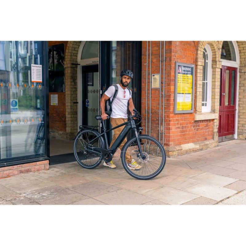 Dawes Spire 1.0 Crossbar - Electric Hybrid Bike - Man Outside with Bike