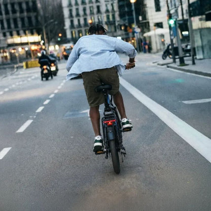 Engwe O20 Boost folding electric bike in Dusty Blue, ridden away along a city street